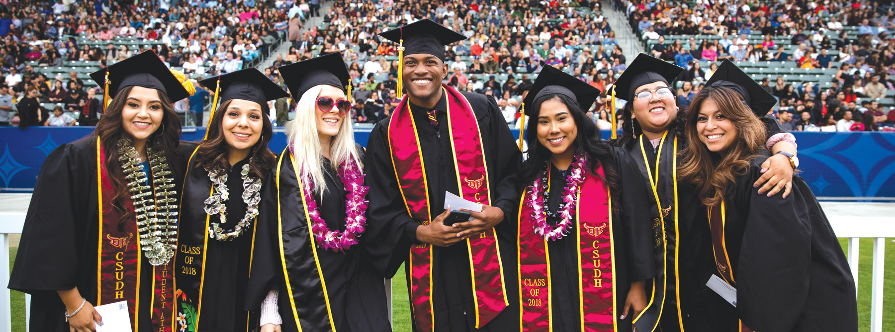 graduates posing for the camera
