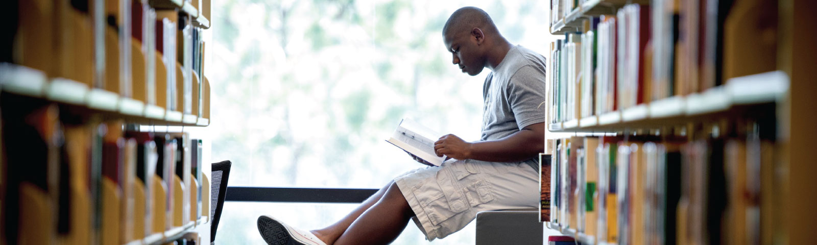 student in library