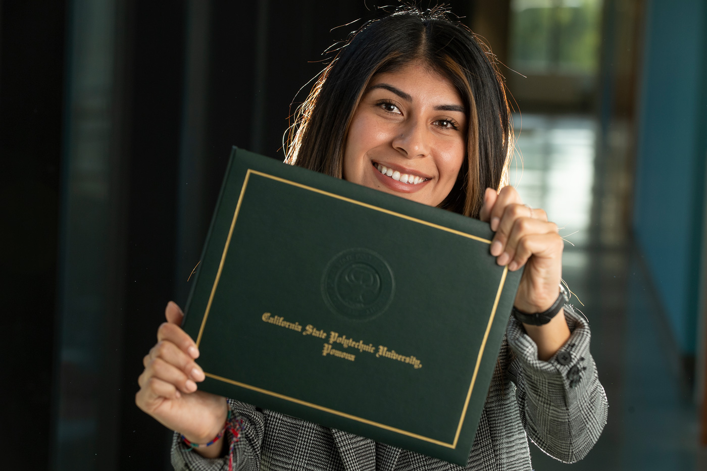 Monica Say with her diploma.