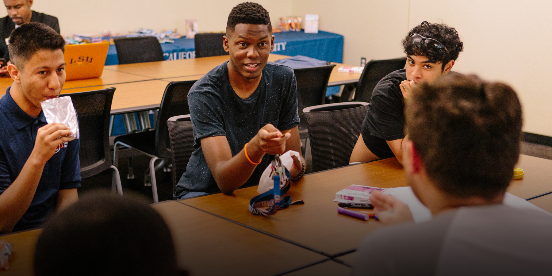Josh talks with members of the Male Success Initiative.