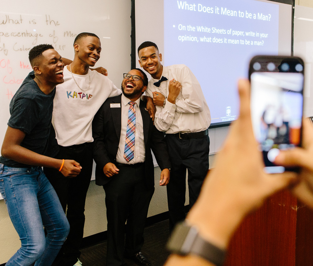 Josh laughs with members of the Male Success Initiative.