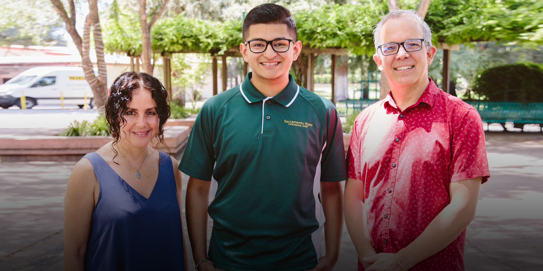 Ignacio stands with his professors Karen Levy and Michael Crain.