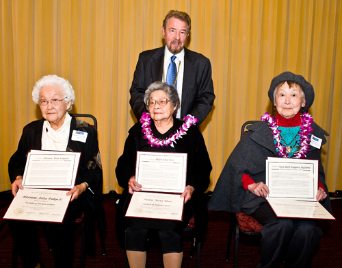 (sitting from left) Hatsune (Arita) Fukuchi, Helen ( Nitta) Hori and Kaya Ruth (Kitagawa) Sugiyama. Standing behind them is San Francisco State University President Robert A. Corrigan