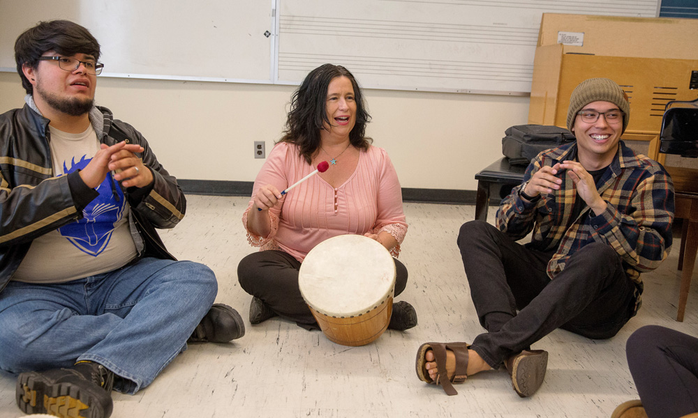 people clapping in a drum circle