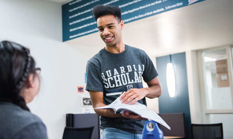Tim working with a student