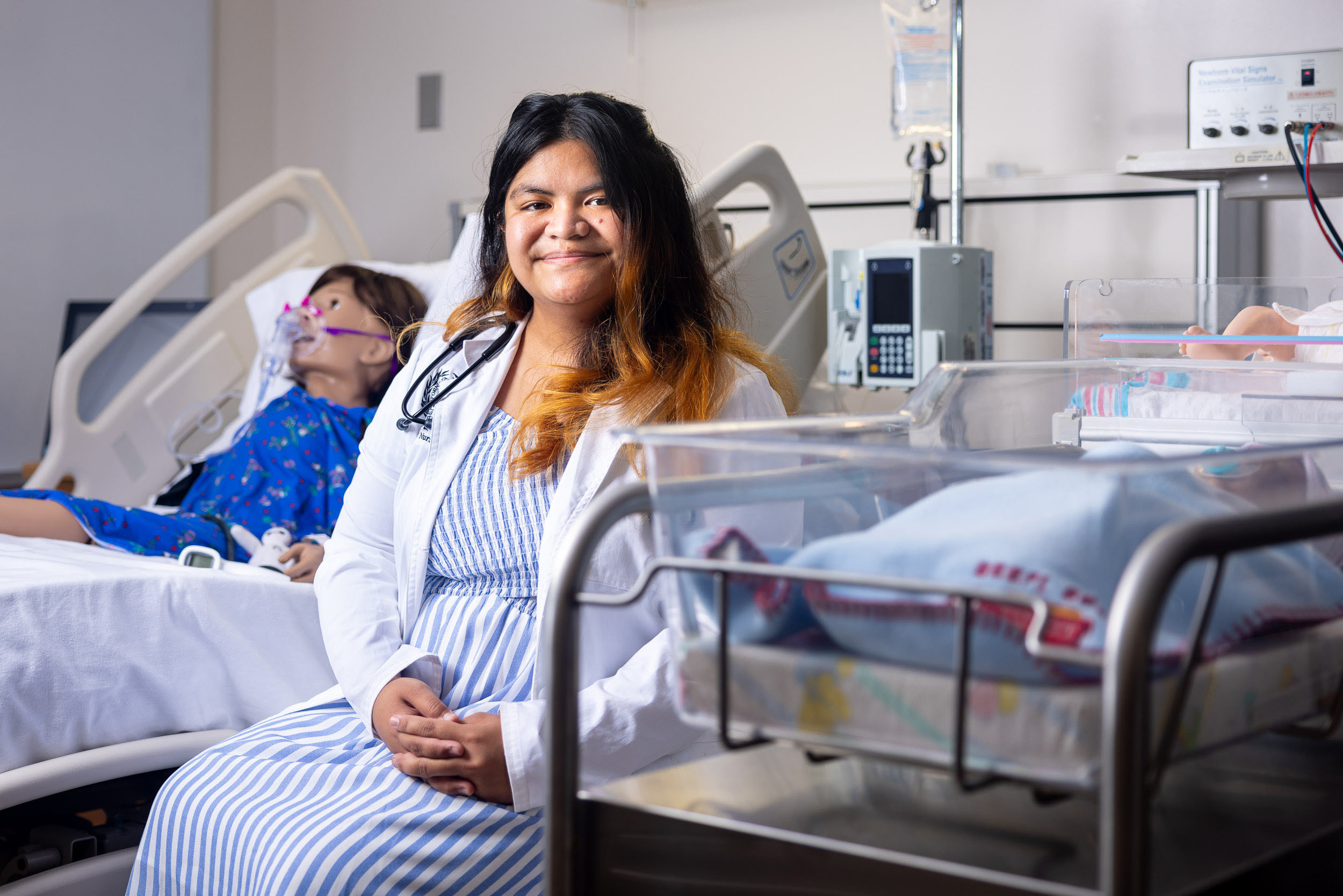 woman in smiling a hospital setting