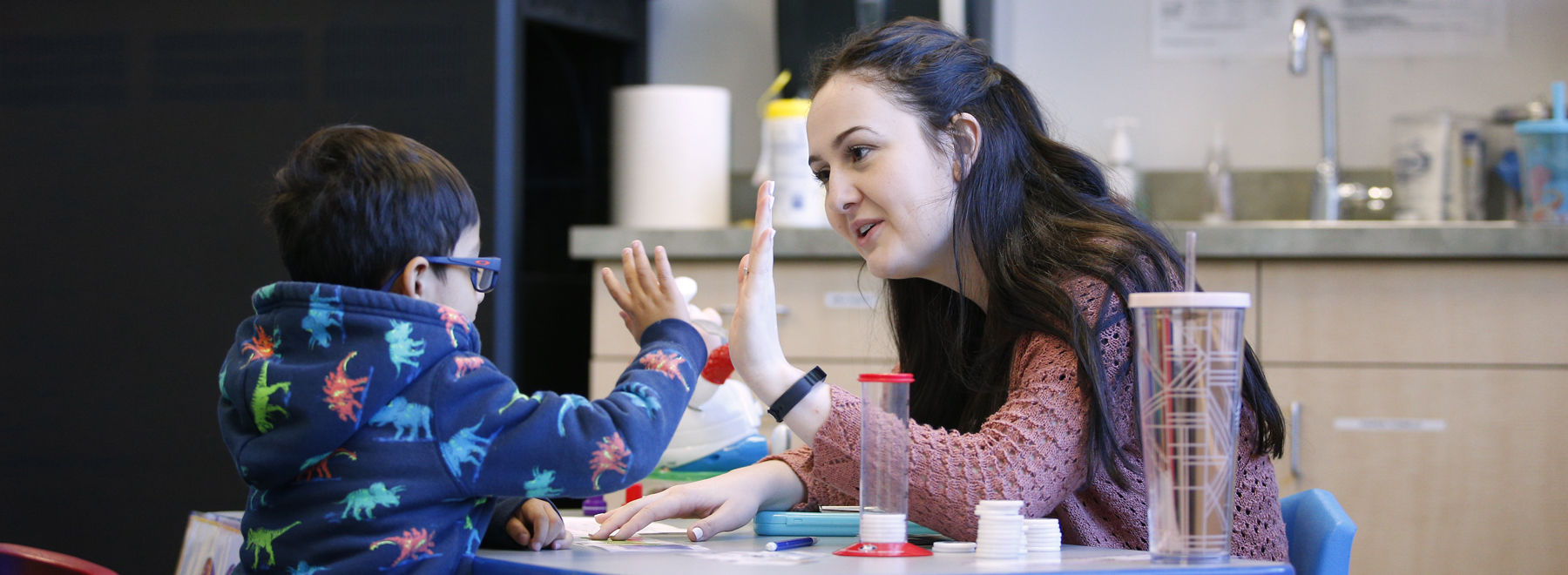 Teacher and young student "High Five"