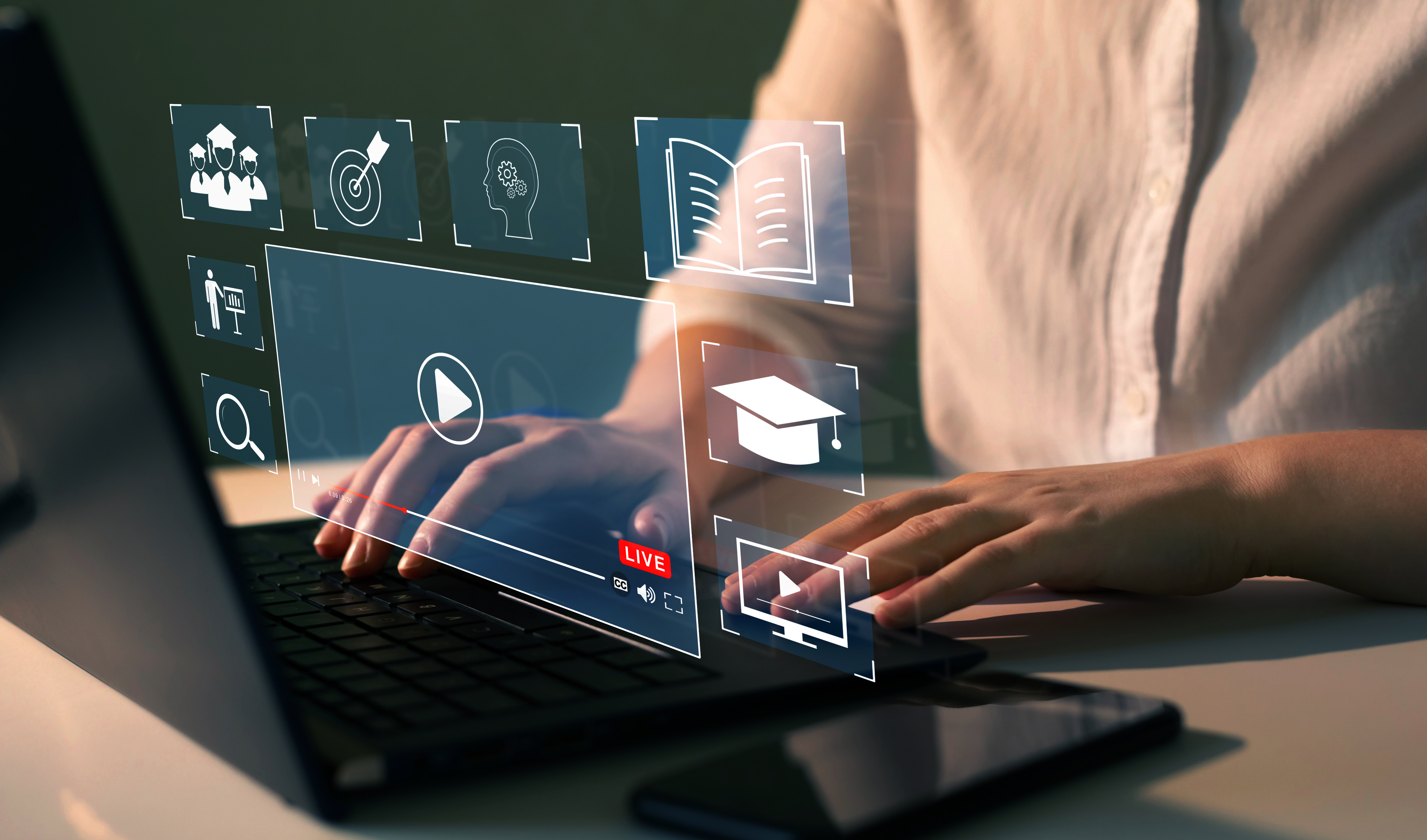 laptop computer with closeup of user pointing at the screen